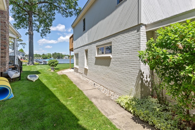 2323 Solano Dr, Wolverine Lake, MI 48390 - view of green lawn featuring a water view