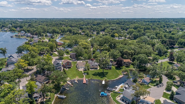 2323 Solano Dr, Wolverine Lake, MI 48390 - aerial perspective of suburban area featuring a nearby body of water and a forest
