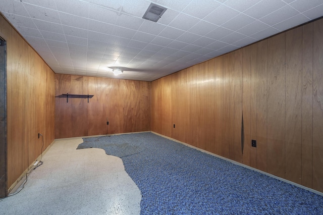 76 Taft St, Battle Creek, MI 49014 - unfurnished room featuring wood walls and carpet flooring