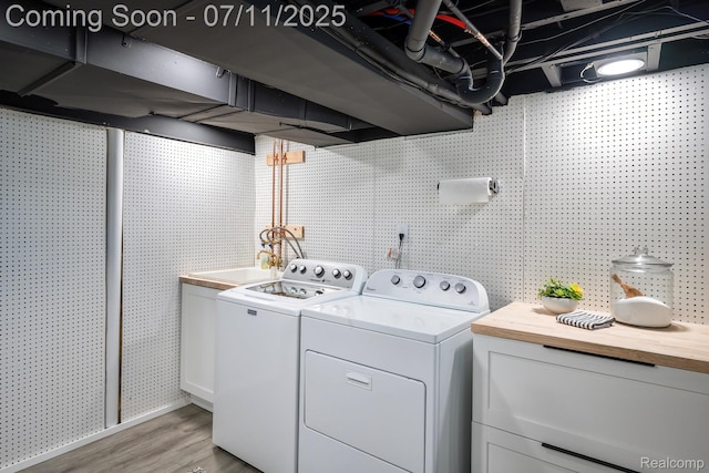 4412 Buckingham Rd, Royal Oak, MI 48073 - washroom featuring washing machine and dryer and light wood-type flooring