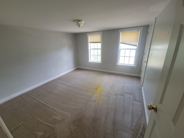560 Lydia St NE, Grand Rapids, MI 49503 - carpeted empty room featuring baseboards