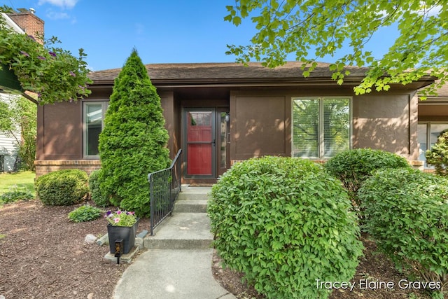 6305 Greenway Dr SE Unit 51, Grand Rapids, MI 49546 - property entrance featuring stucco siding