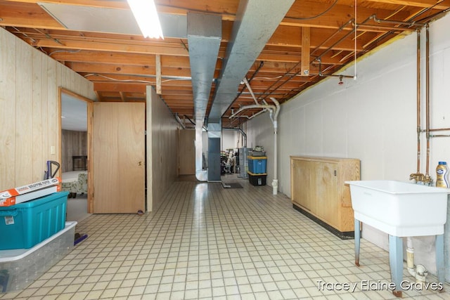 6305 Greenway Dr SE Unit 51, Grand Rapids, MI 49546 - basement with water heater and light floors