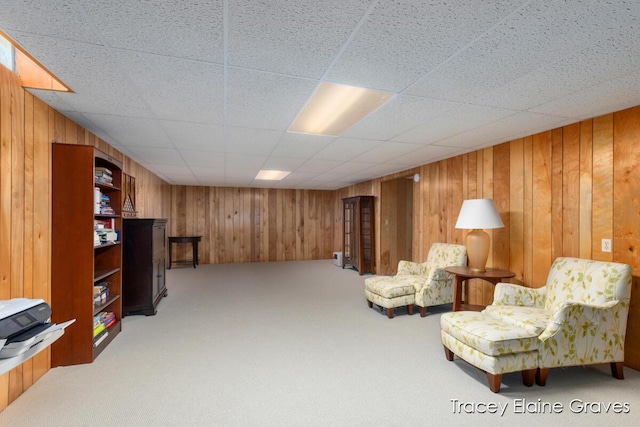 6305 Greenway Dr SE Unit 51, Grand Rapids, MI 49546 - sitting room with wooden walls and light carpet