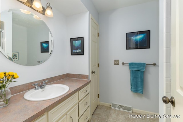 6305 Greenway Dr SE Unit 51, Grand Rapids, MI 49546 - bathroom featuring vanity and tile patterned floors