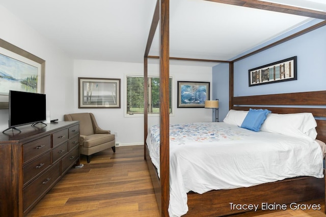 6305 Greenway Dr SE Unit 51, Grand Rapids, MI 49546 - bedroom featuring dark wood finished floors and baseboards