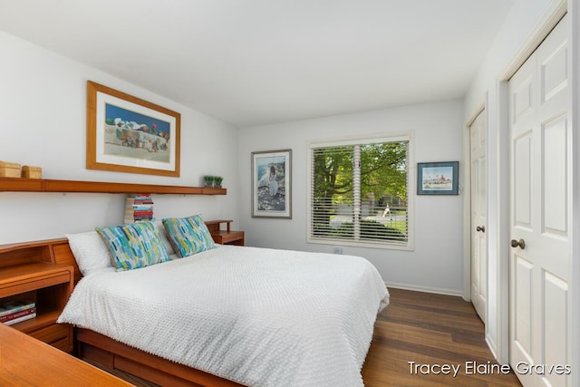 6305 Greenway Dr SE Unit 51, Grand Rapids, MI 49546 - bedroom with dark wood-style flooring and baseboards