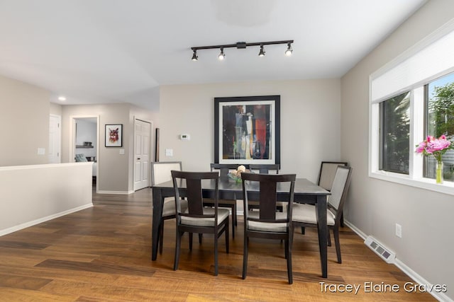 6305 Greenway Dr SE Unit 51, Grand Rapids, MI 49546 - dining area with wood finished floors and rail lighting