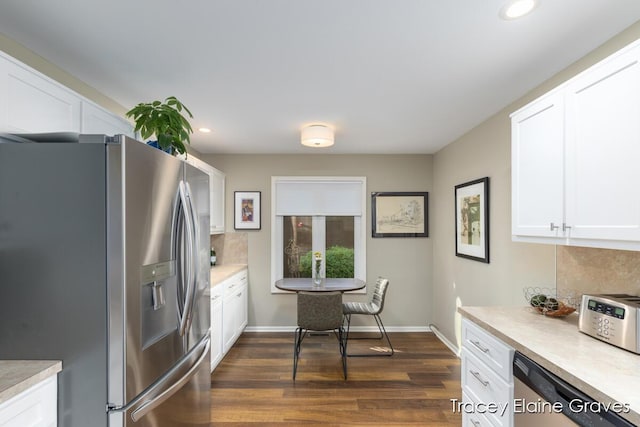 6305 Greenway Dr SE Unit 51, Grand Rapids, MI 49546 - kitchen with appliances with stainless steel finishes, recessed lighting, white cabinetry, light countertops, and dark wood-style floors