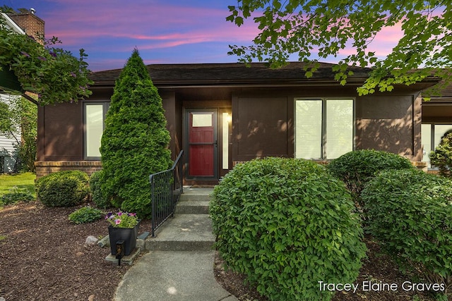 6305 Greenway Dr SE Unit 51, Grand Rapids, MI 49546 - exterior entry at dusk with stucco siding