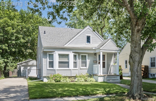 1416 N Alexander Ave, Royal Oak, MI 48067 - view of front of house with an outdoor structure, roof with shingles, and a detached garage