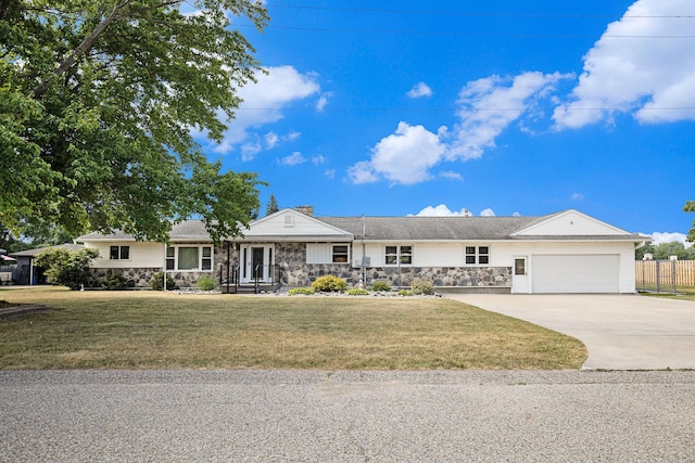 236 Jeffrey St NE, Cedar Springs, MI 49319 - ranch-style house featuring stone siding, a garage, concrete driveway, and a chimney