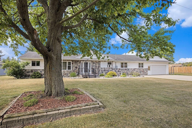 236 Jeffrey St NE, Cedar Springs, MI 49319 - ranch-style home featuring stone siding, an attached garage, and concrete driveway