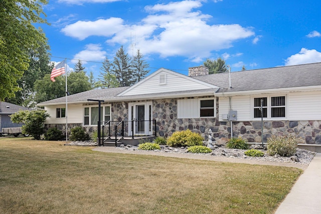236 Jeffrey St NE, Cedar Springs, MI 49319 - ranch-style home with stone siding, a front lawn, a chimney, and a shingled roof