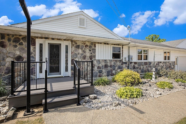236 Jeffrey St NE, Cedar Springs, MI 49319 - view of front of home featuring stone siding and a porch