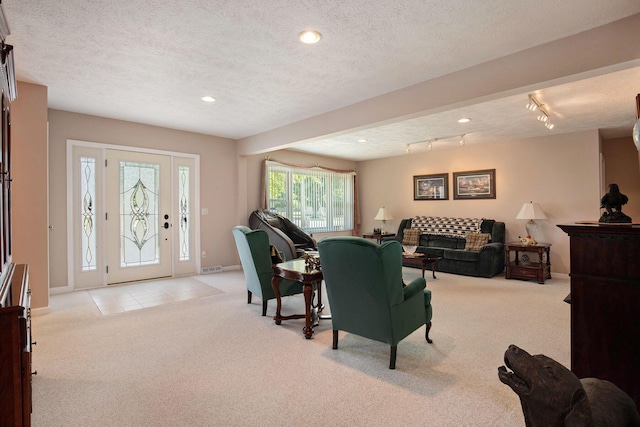 236 Jeffrey St NE, Cedar Springs, MI 49319 - living room with light colored carpet, a textured ceiling, recessed lighting, and rail lighting
