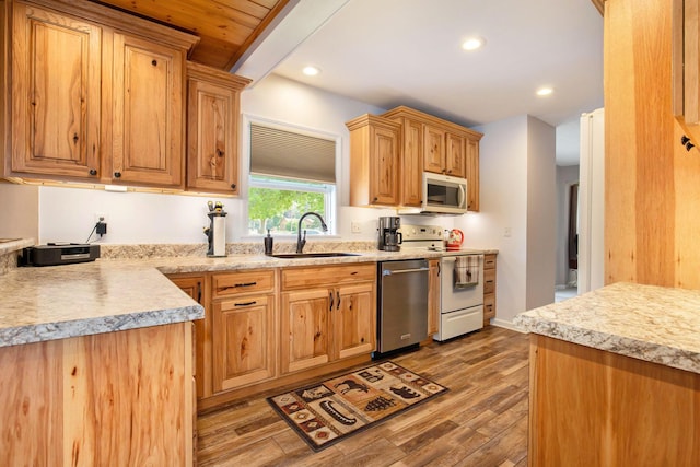 236 Jeffrey St NE, Cedar Springs, MI 49319 - kitchen featuring appliances with stainless steel finishes, light wood-style floors, and recessed lighting