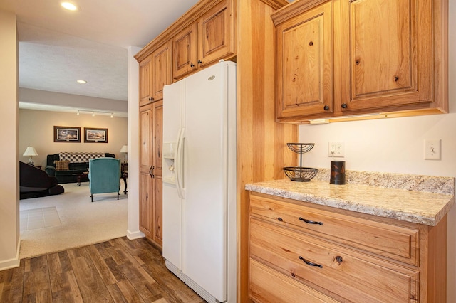 236 Jeffrey St NE, Cedar Springs, MI 49319 - kitchen featuring white refrigerator with ice dispenser, dark wood-style floors, light stone countertops, recessed lighting, and rail lighting