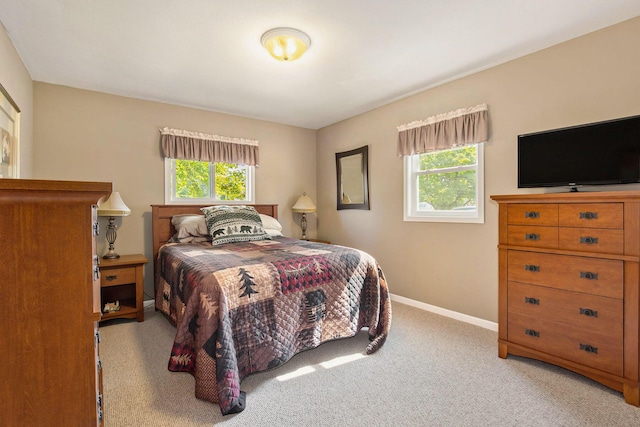 236 Jeffrey St NE, Cedar Springs, MI 49319 - bedroom with light colored carpet and baseboards