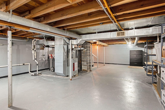 236 Jeffrey St NE, Cedar Springs, MI 49319 - unfinished below grade area featuring concrete block wall and heating unit