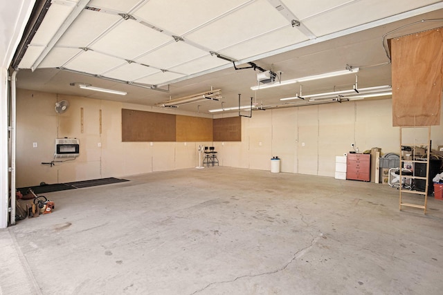 236 Jeffrey St NE, Cedar Springs, MI 49319 - garage with heating unit and a garage door opener