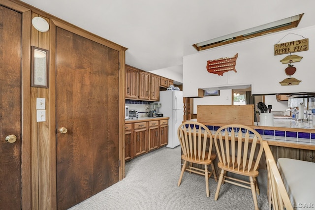 318 E Adrian St, Blissfield, MI 49228 - dining space with light carpet