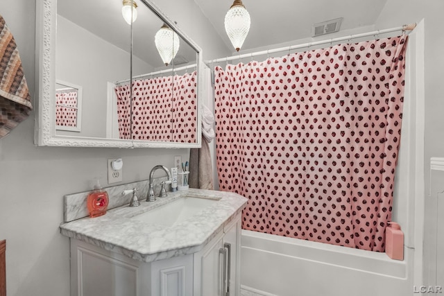 318 E Adrian St, Blissfield, MI 49228 - bathroom featuring vanity and shower / bath combo with shower curtain