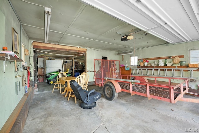 318 E Adrian St, Blissfield, MI 49228 - garage with a garage door opener and a workshop area