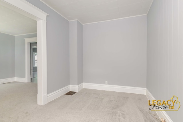 445 Prince St SE, Grand Rapids, MI 49507 - carpeted spare room featuring ornamental molding and baseboards