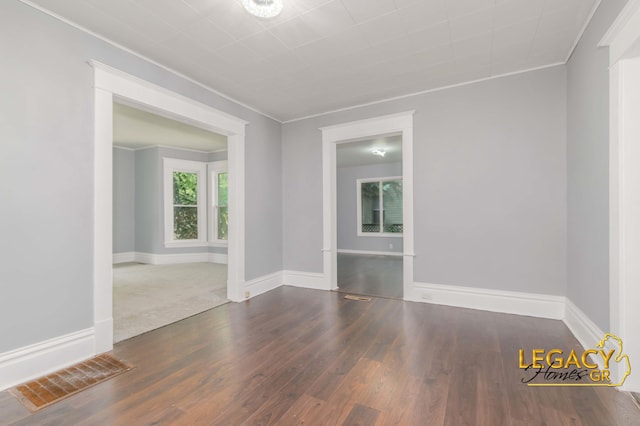 445 Prince St SE, Grand Rapids, MI 49507 - unfurnished room with wood finished floors and ornamental molding