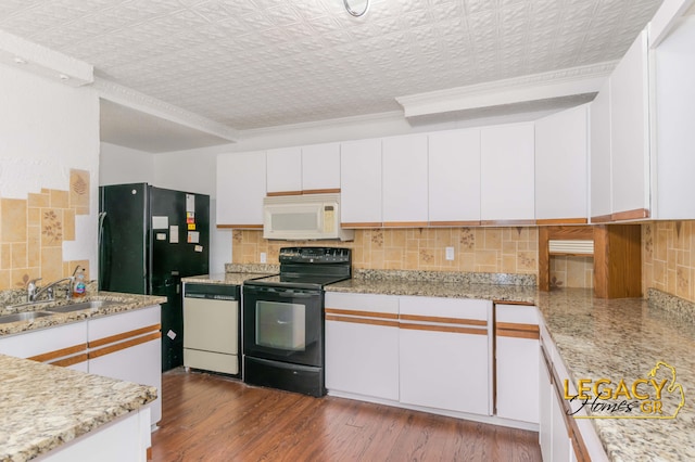 445 Prince St SE, Grand Rapids, MI 49507 - kitchen with black appliances, ornamental molding, white cabinetry, backsplash, and an ornate ceiling