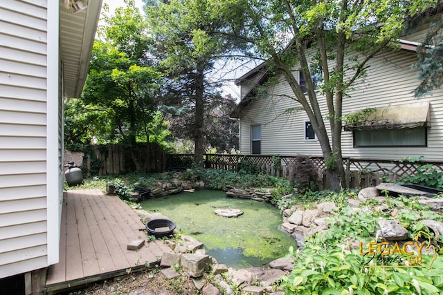 445 Prince St SE, Grand Rapids, MI 49507 - fenced backyard featuring a small pond
