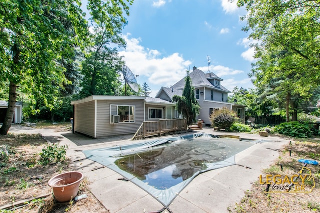 445 Prince St SE, Grand Rapids, MI 49507 - back of property featuring a deck and a covered pool