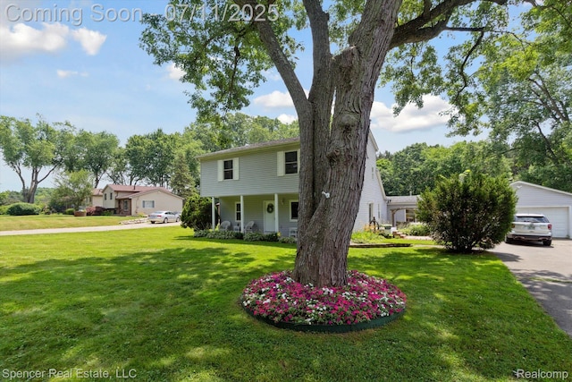 5045 Pine Knob Trl, Clarkston, MI 48346 - view of front of home featuring a front lawn, a detached garage, and a porch