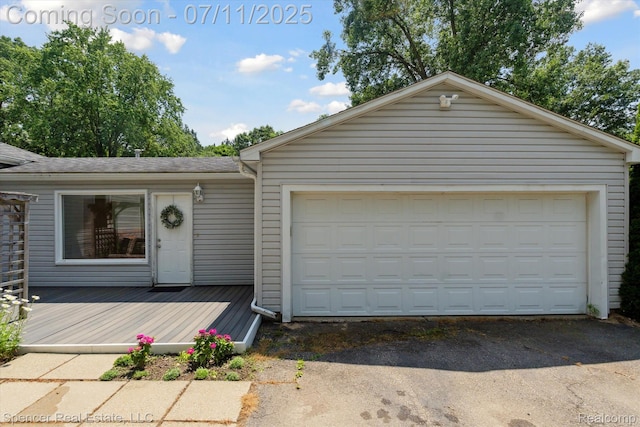5045 Pine Knob Trl, Clarkston, MI 48346 - single story home featuring a garage, a deck, an outbuilding, and a shingled roof