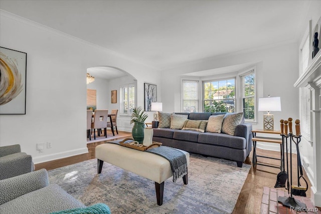 4800 Bishop St, Detroit, MI 48224 - living area with arched walkways, healthy amount of natural light, wood finished floors, and ornamental molding