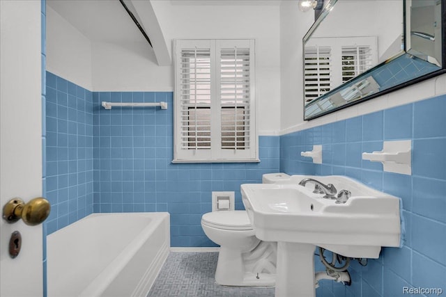 4800 Bishop St, Detroit, MI 48224 - bathroom featuring tile walls, tile patterned flooring, and a wainscoted wall