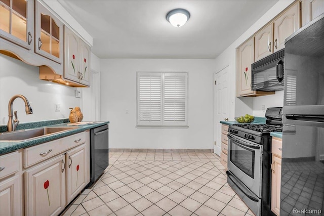 4800 Bishop St, Detroit, MI 48224 - kitchen with black appliances, glass insert cabinets, light tile patterned floors, and dark countertops