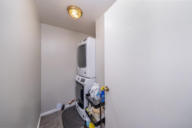 1051 Vallado Dr, Weidman, MI 48893 - washroom with estacked washer and dryer and baseboards