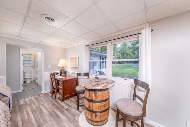 1051 Vallado Dr, Weidman, MI 48893 - sitting room featuring a drop ceiling, light wood-style floors, and healthy amount of natural light
