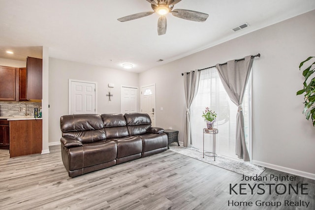 3508 River Run St, Wyoming, MI 49418 - living room with ceiling fan and light wood-type flooring