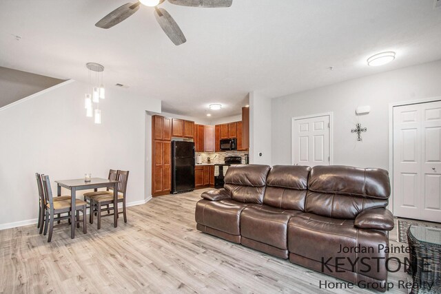 3508 River Run St, Wyoming, MI 49418 - living room featuring light wood-style flooring and ceiling fan