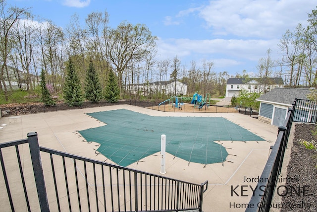 3508 River Run St, Wyoming, MI 49418 - view of swimming pool with a playground and a patio