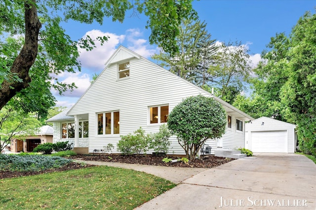 751 Old Gate Rd NW, Grand Rapids, MI 49504 - view of home's exterior with an outbuilding, concrete driveway, and a garage