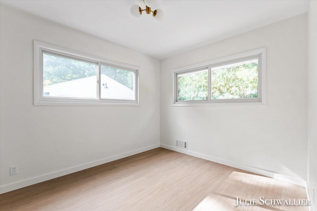 751 Old Gate Rd NW, Grand Rapids, MI 49504 - unfurnished room featuring wood finished floors and baseboards