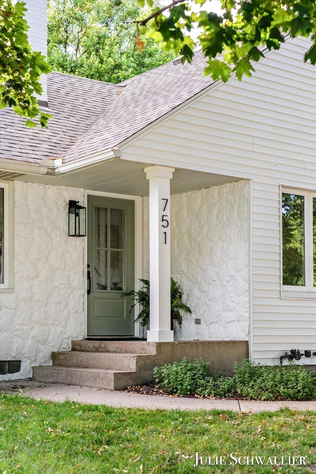 751 Old Gate Rd NW, Grand Rapids, MI 49504 - property entrance featuring roof with shingles