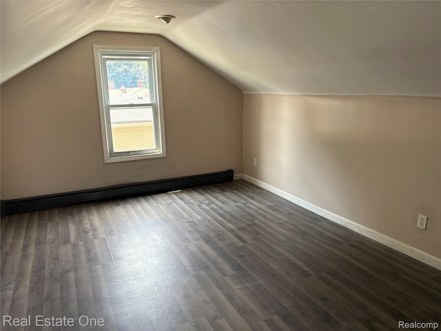 5873 Elmgrove Ave, Warren, MI 48092 - additional living space featuring dark wood-style flooring, vaulted ceiling, and baseboard heating