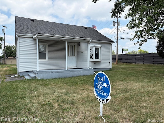 5873 Elmgrove Ave, Warren, MI 48092 - bungalow-style home featuring a porch and a shingled roof