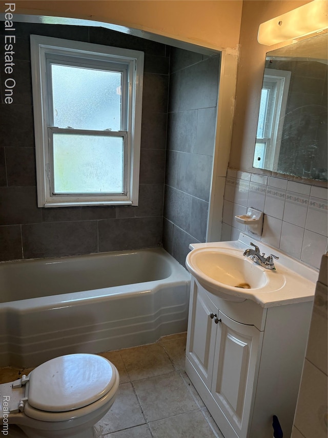 5873 Elmgrove Ave, Warren, MI 48092 - full bathroom with a bathtub, vanity, tile patterned floors, and tile walls