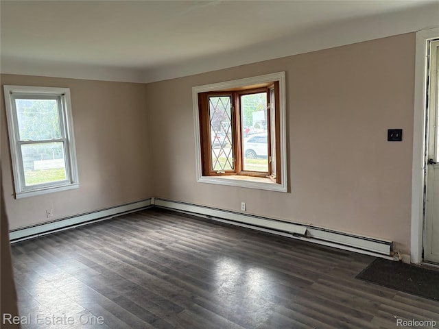 5873 Elmgrove Ave, Warren, MI 48092 - unfurnished room featuring a baseboard heating unit, wood finished floors, and baseboard heating